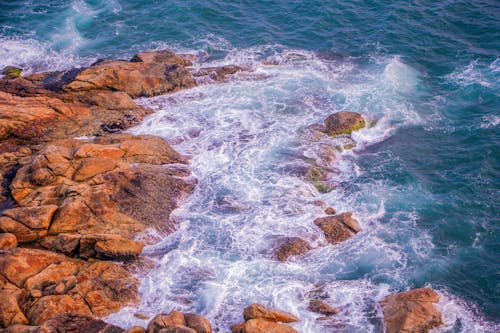 Free Waves Crashing on Rocks Stock Photo
