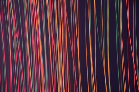 Colorful abstract lines on a dark background creating a vibrant and modern art style.