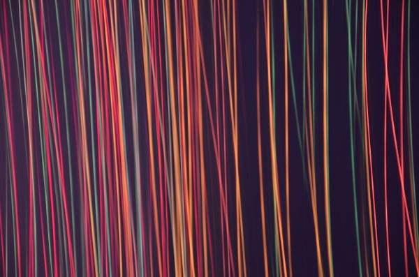 Coloured light streaks against a dark background — photoGraph on Pexels