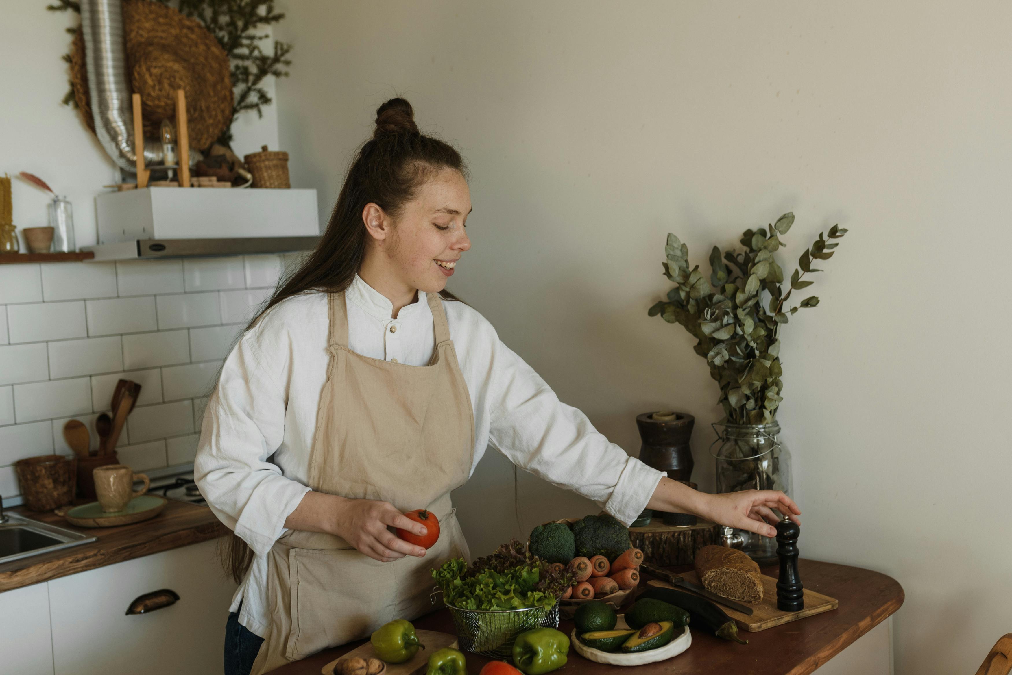 A Woman Pouring Sugar in a Pot · Free Stock Photo