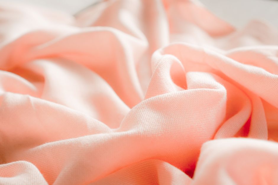High-quality organic cotton swaddle texture showing open weave High-quality organic cotton swaddle texture showing open weave