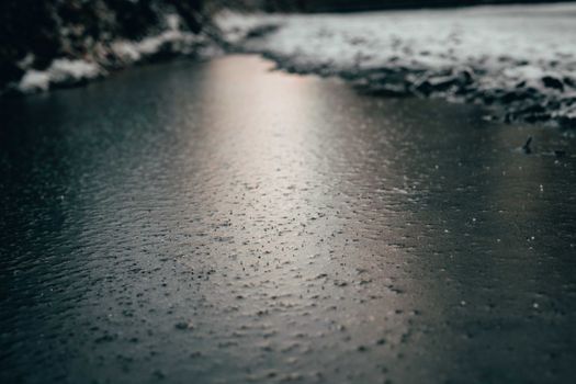 Close-up view of a frozen river surface, capturing the tranquility of winter's grip.