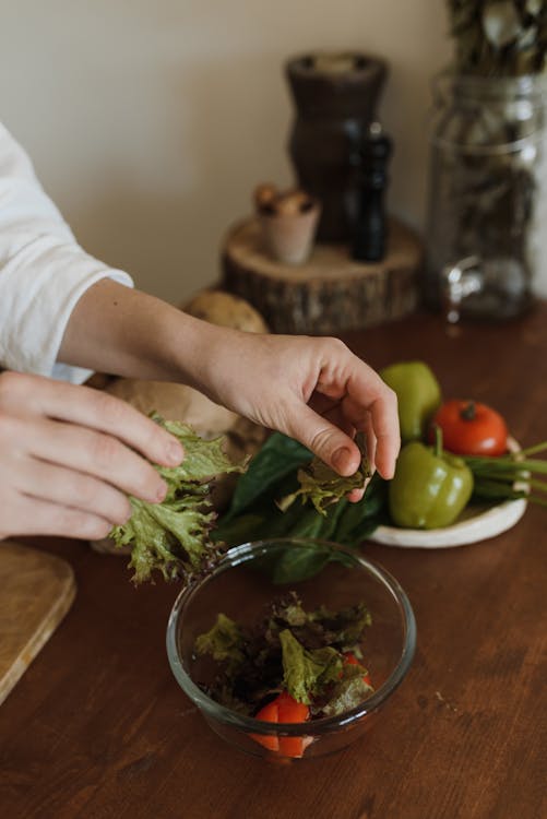Free Close Shot of a Person Making a Vegetable Salad Stock Photo