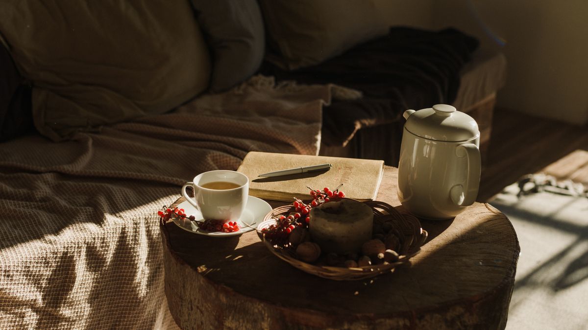Photo: Arina Krasnikova / Pexels Tea tray, book and blanket on a sunlit bed
