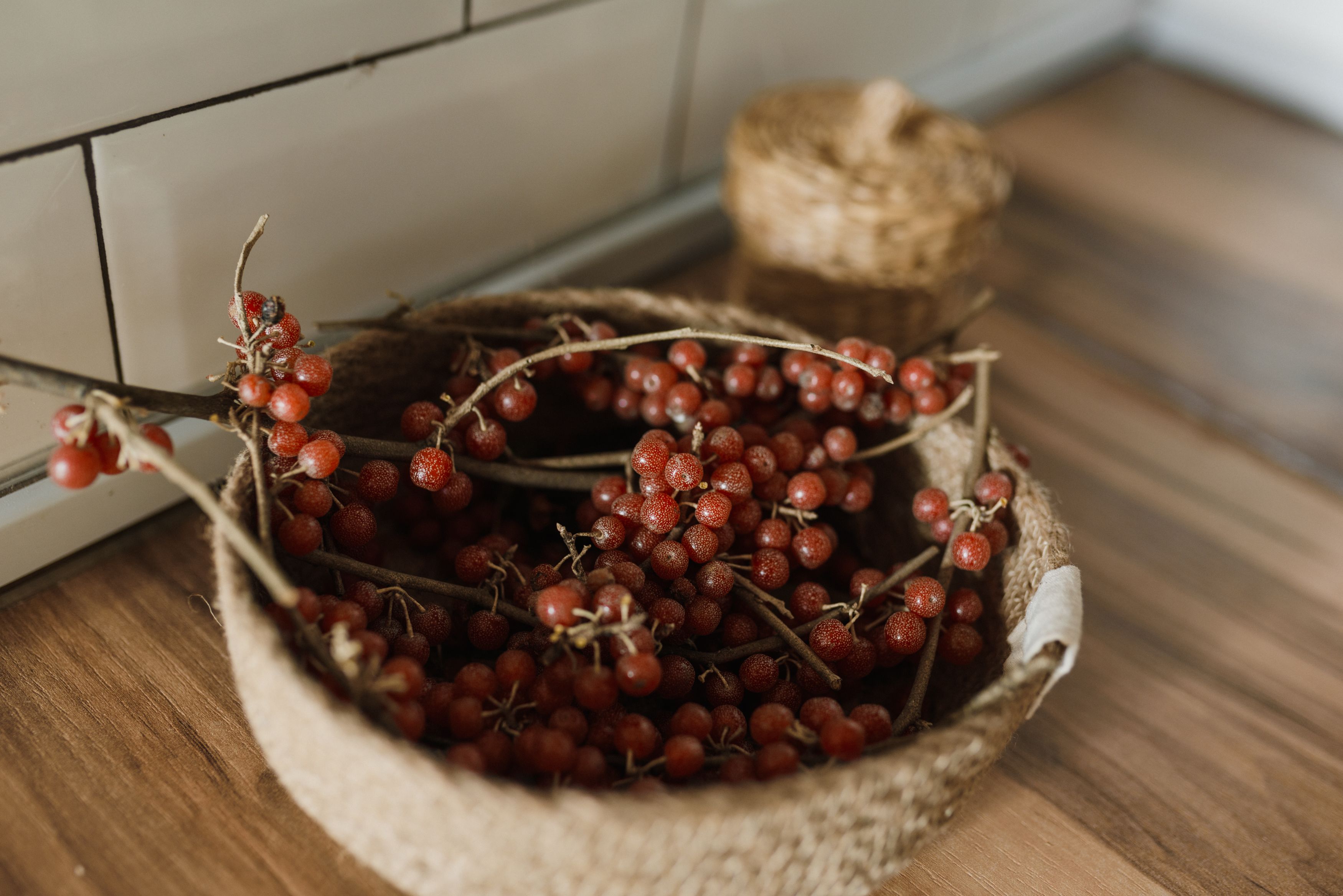 Freshly picked Xianju bayberries in a bamboo basket