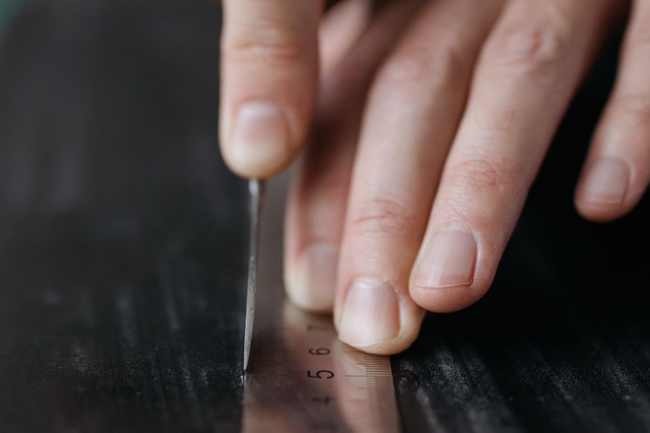 measuring finger with paper strip and ruler measuring finger with paper strip and ruler