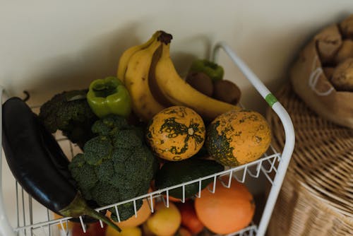 Assorted Fruits and Vegetables on a White Rack