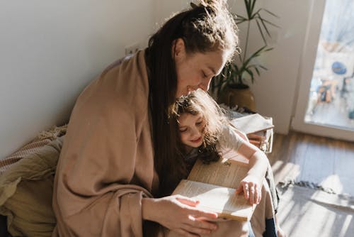 Free Mother and Daughter Reading a Book Stock Photo