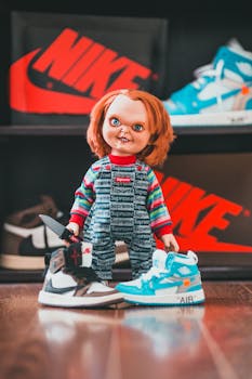Chucky doll in Supreme outfit posed with trendy sneakers and Nike logos.