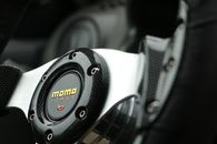 A Close-Up Shot of a Steering Wheel with Logo