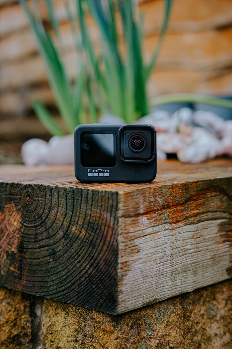 Go Pro Camera Laid On Wood