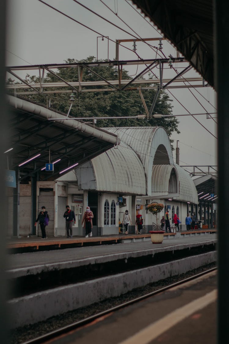 People Walking On The Train Station Platform