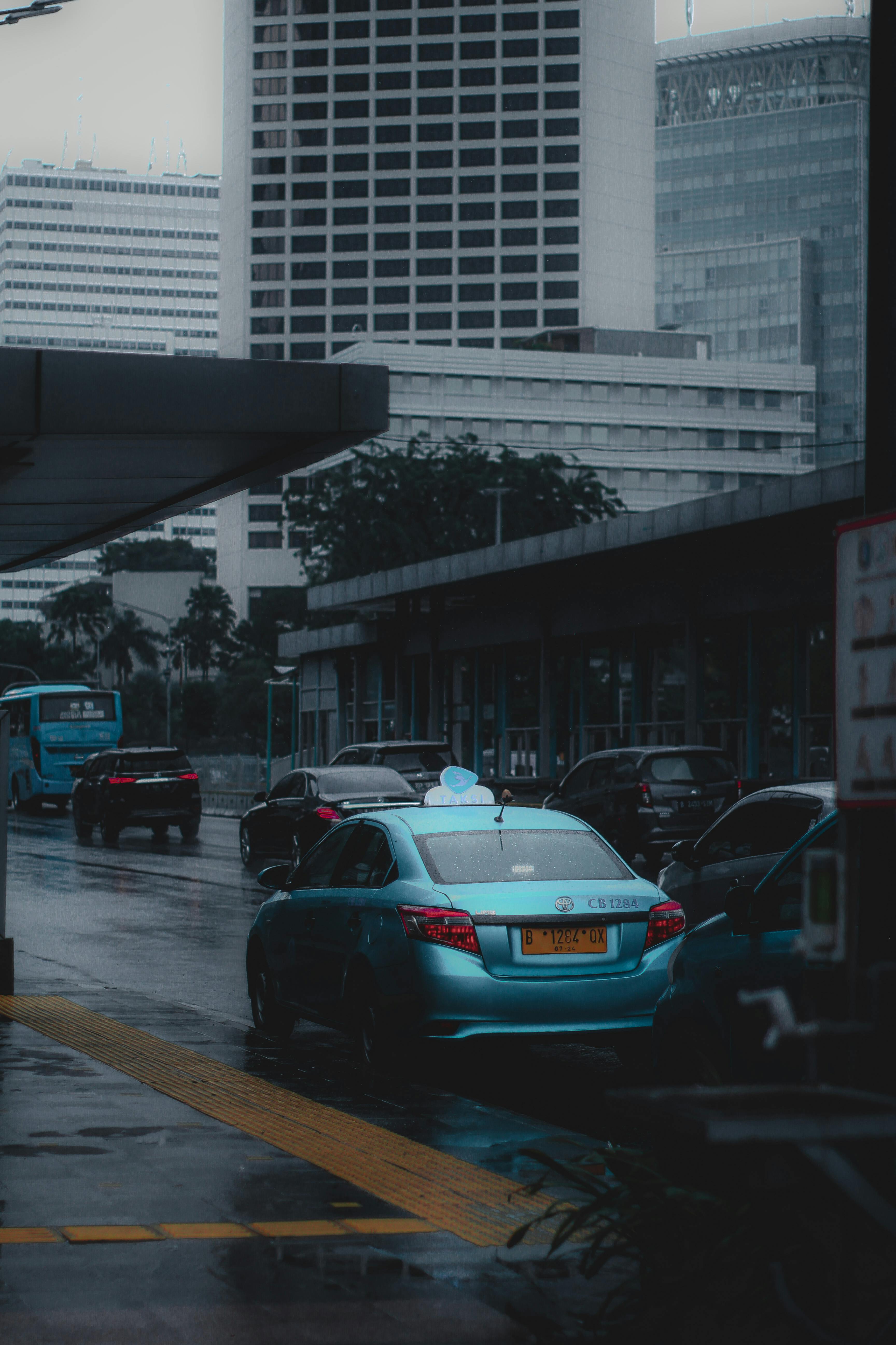 ComfortDelGro taxi cab driving along Orchard Road shopping district in Singapore