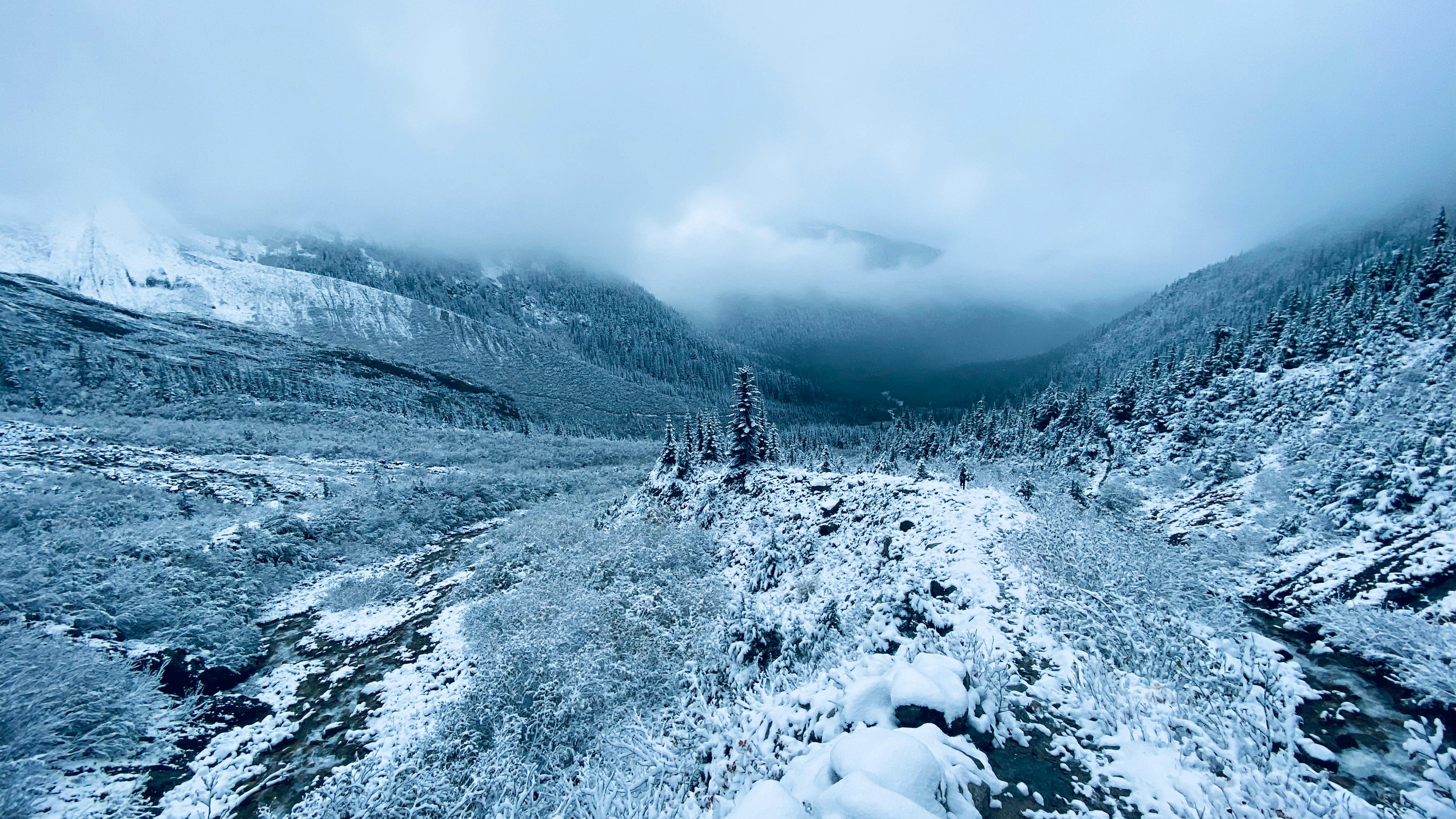 Snow Covered Mountain Under Cloudy Sky · Free Stock Photo