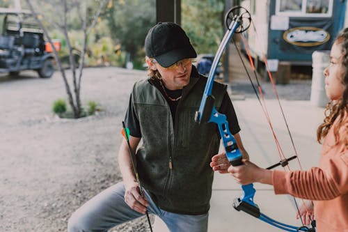 A Girl Holding an Archery Bow