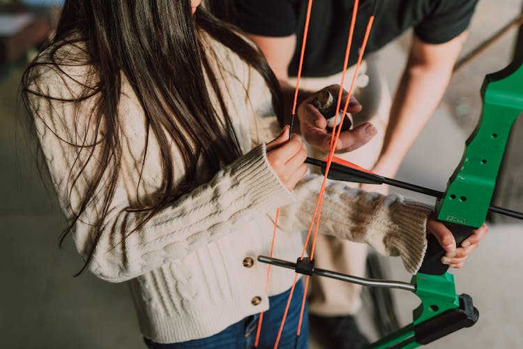 A Girl Holding An Archery Bow