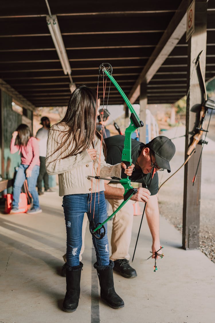 A Girl Holding An Archery Bow