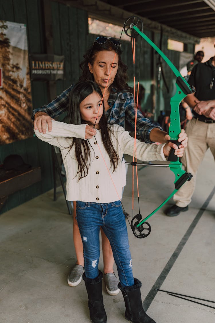 A Girl Holding An Archery Bow