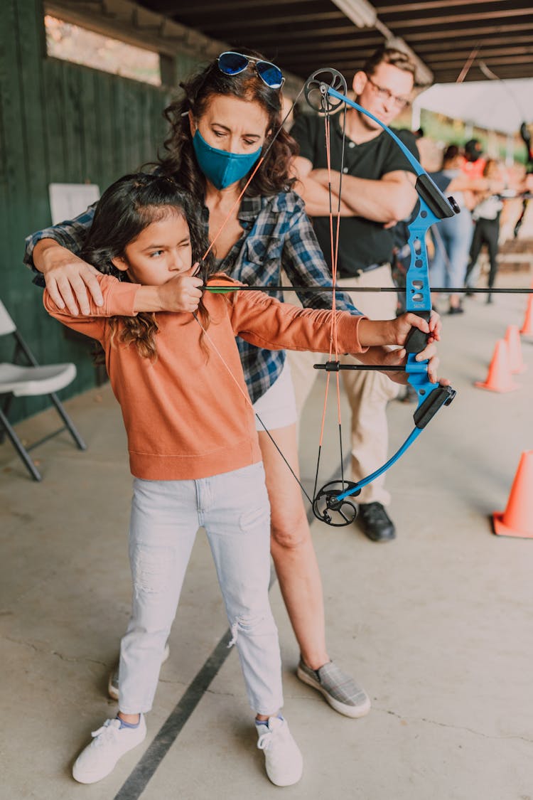 A Girl Holding An Archery Bow