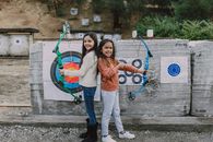 Two Girls Holding an Archery Bow