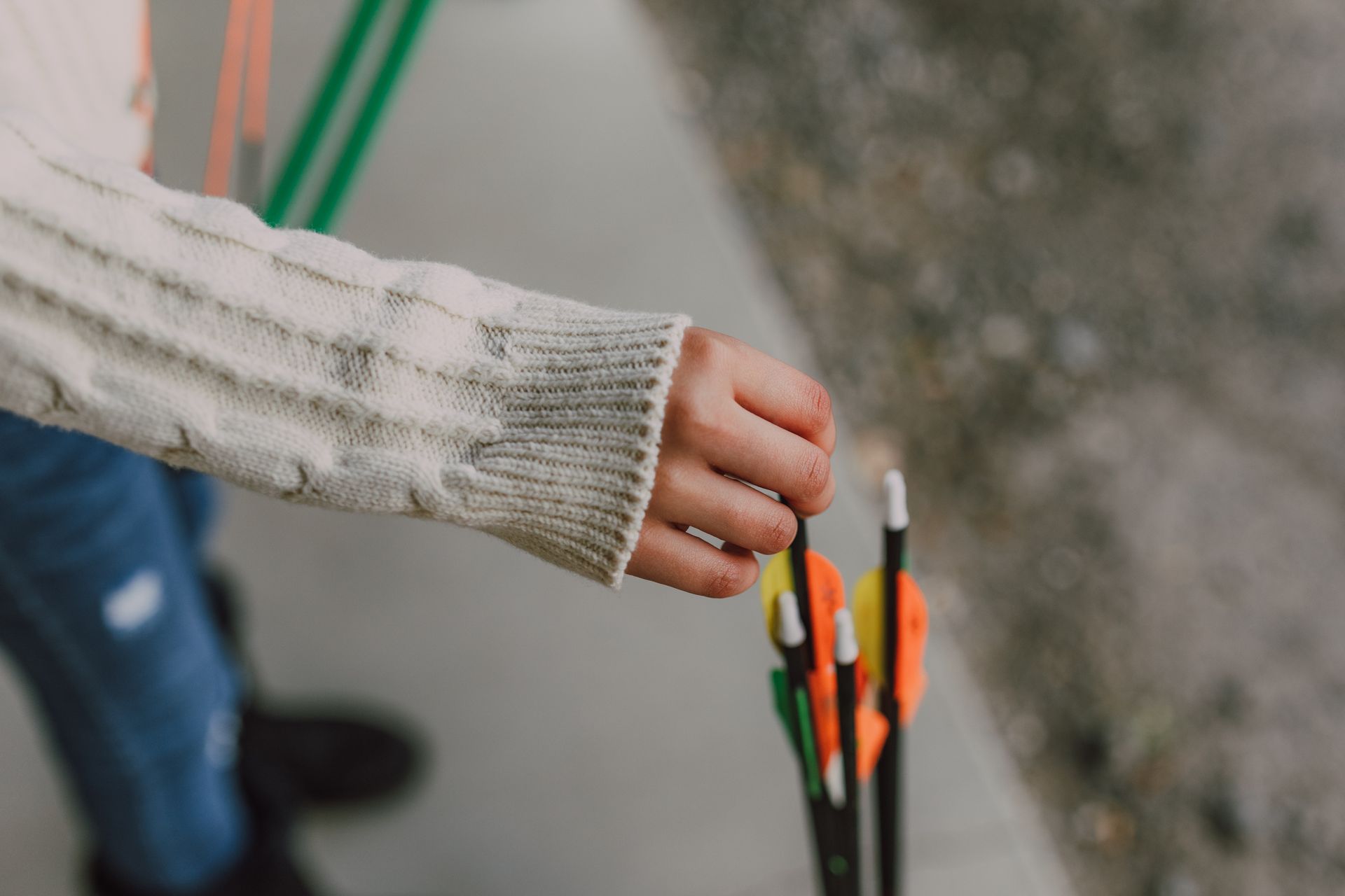 Close-Up Shot of a Person Holding an Arrow