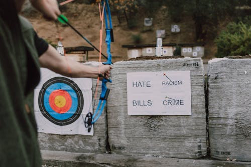 Person Holding Bow ad Arrow Playing Archery 