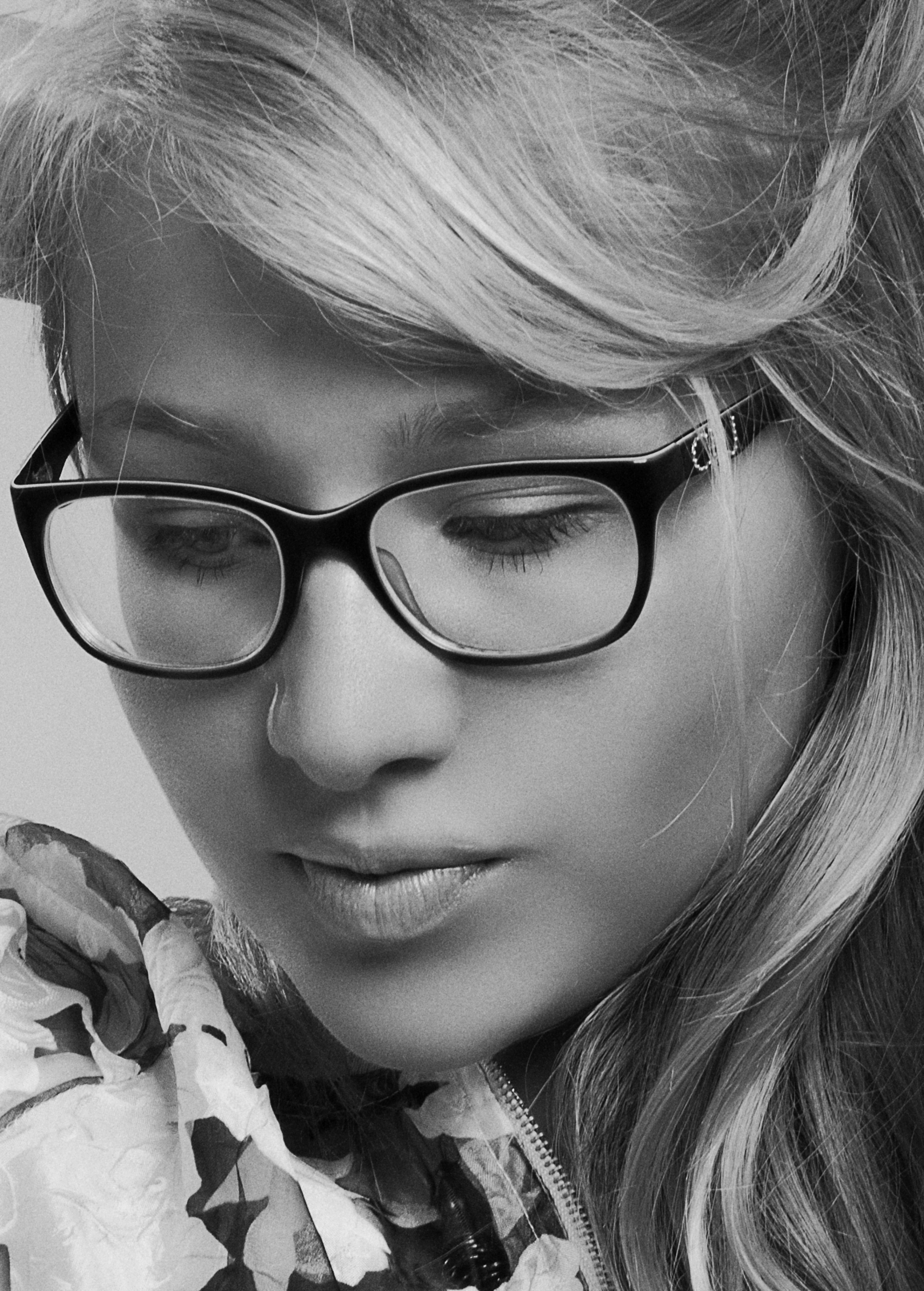 Artistic monochrome portrait of a woman in glasses, Kyiv.