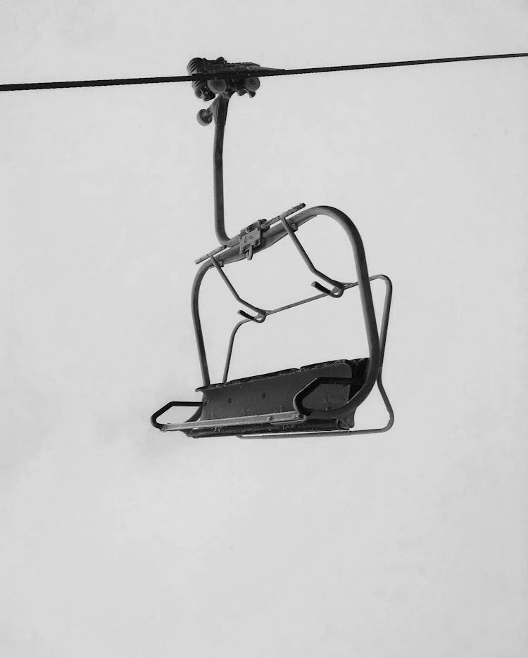 Grayscale Photo Of A Chairlift