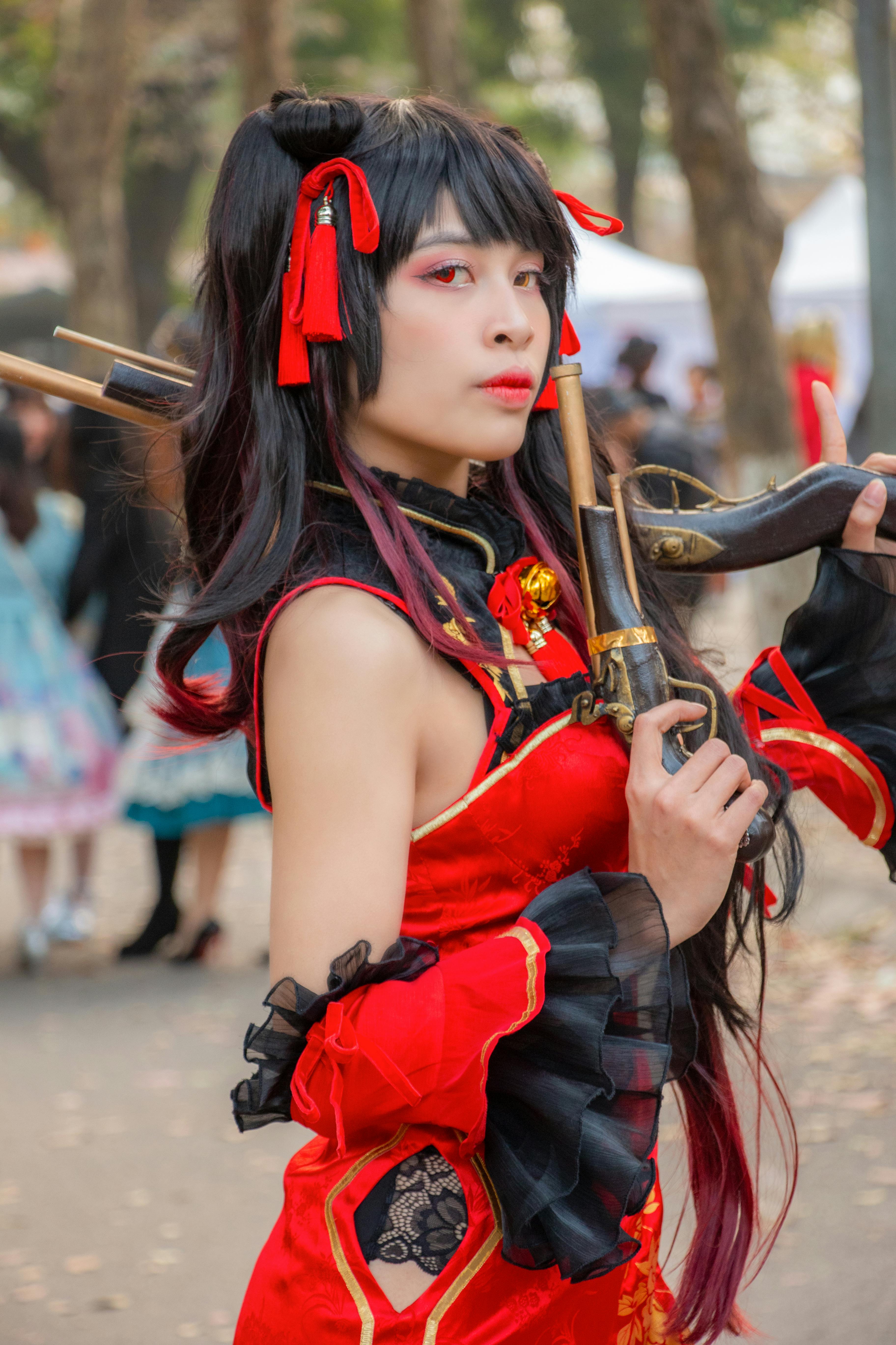 a woman wearing a costume with old guns