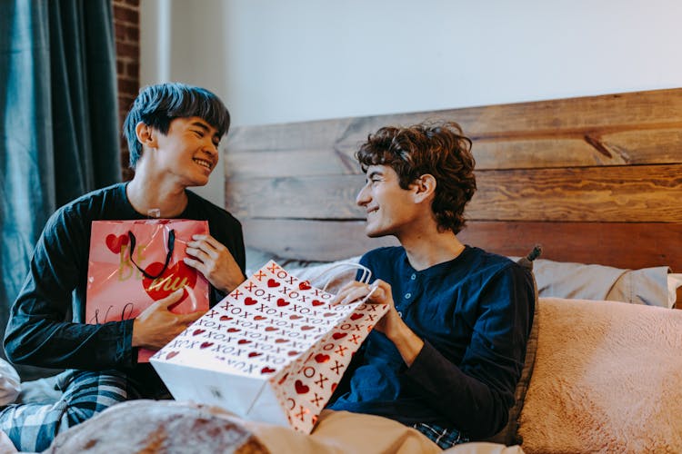 A Romantic Couple Holding Gifts 