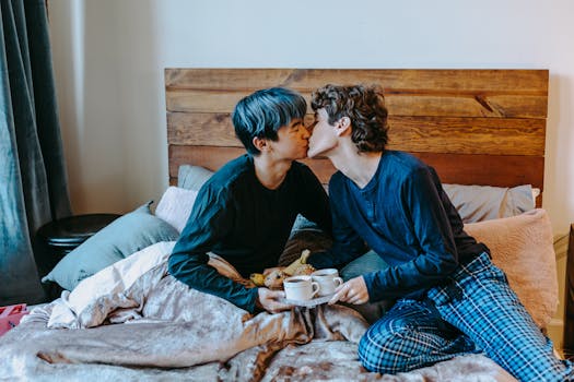 Loving couple sharing a romantic morning with breakfast in bed, embodying warmth and tenderness.