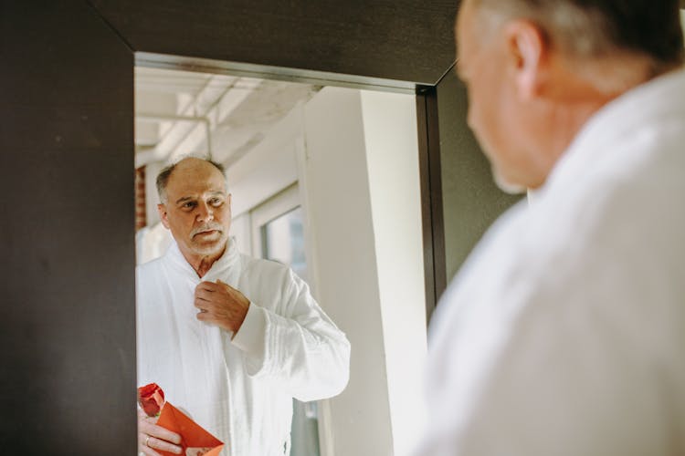 Elderly Man Looking In The Mirror