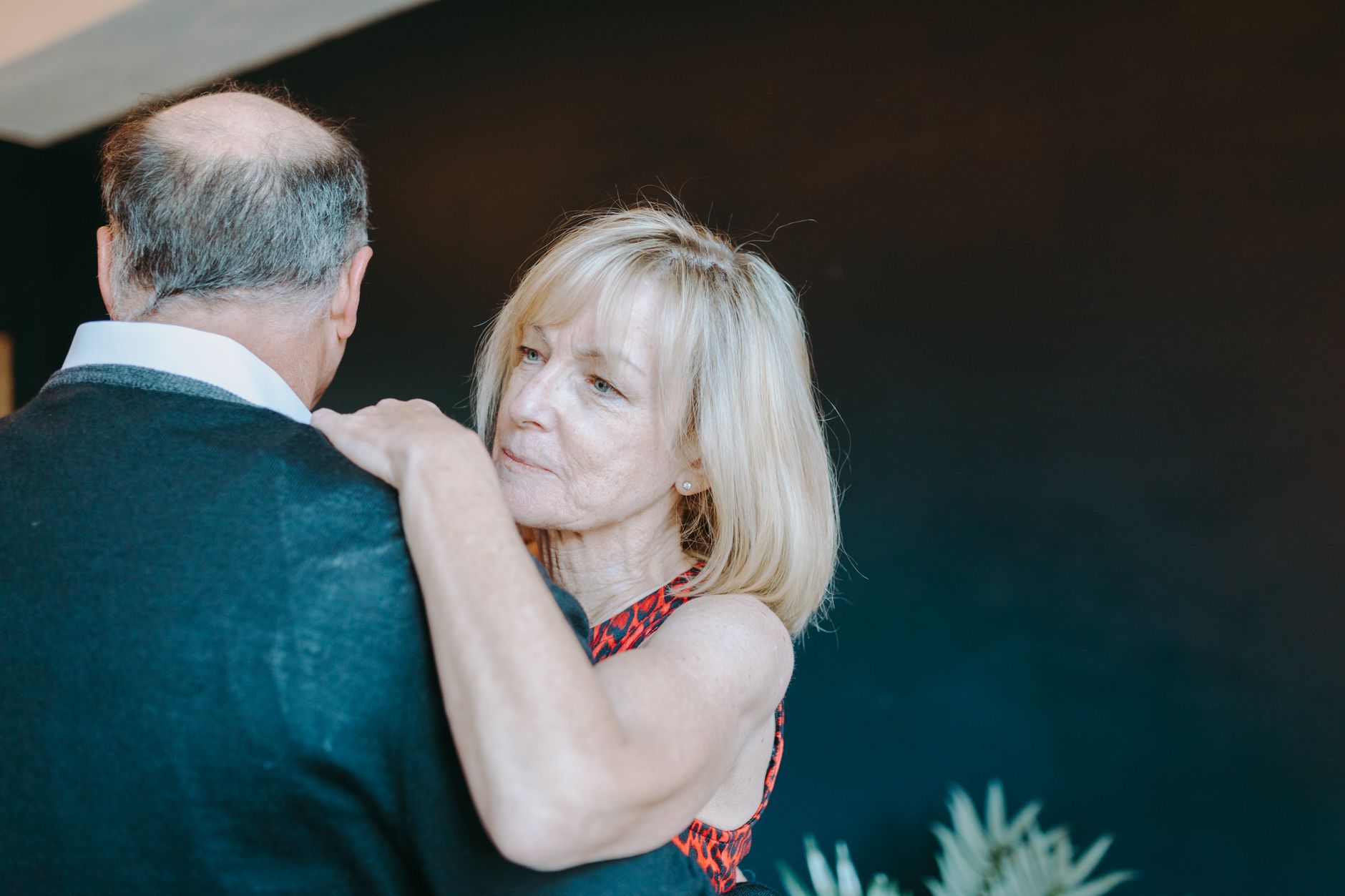 Senior couple sharing an intimate dance, showcasing love and affection.