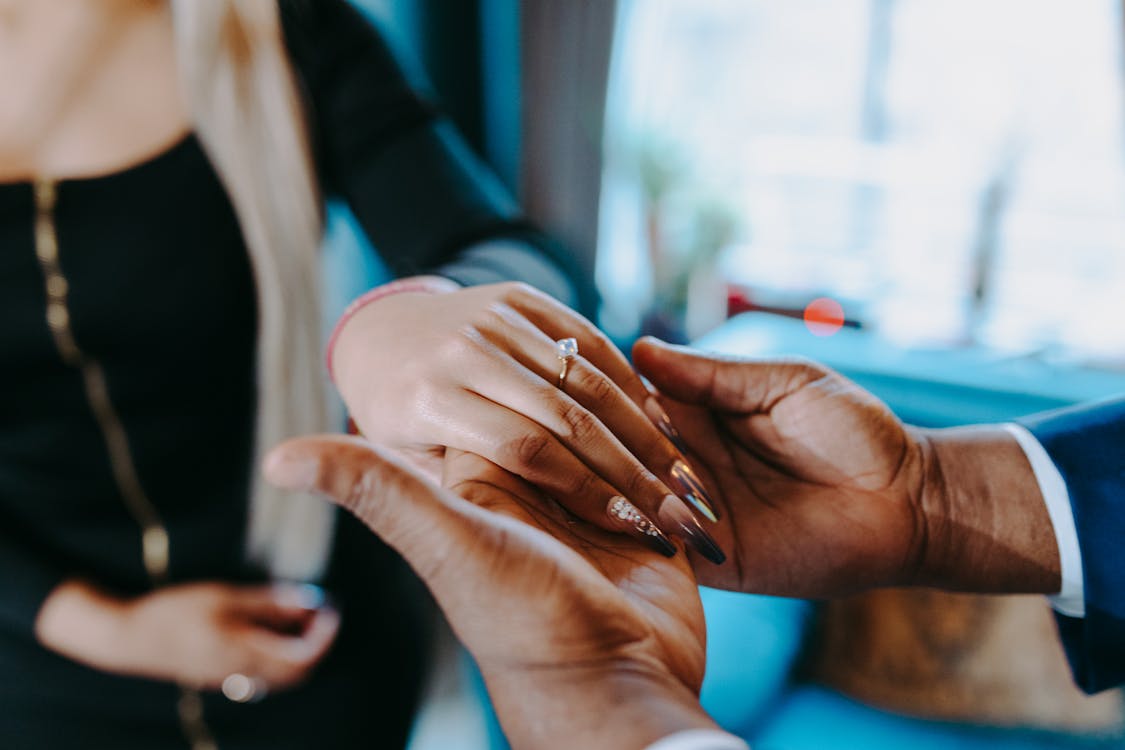 Free Man Holding a Woman's Hand Stock Photo