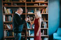 Man in Black Suit Jacket and Woman in Red Dress