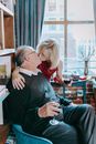 Woman in Black Sweater Sitting Beside Man in Black Sweater