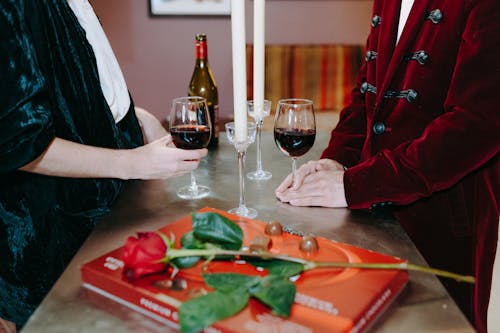 A Couple Holding a Wine Glass