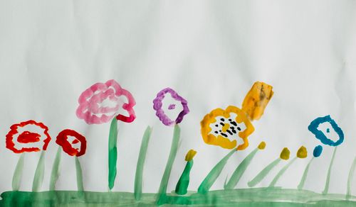 Watercolour painting of vibrant flowers on a white ground — photo by Markus Spiske on Pexels