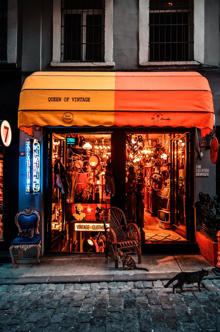 Facade Of Store With Vintage Furniture And Objects In Street