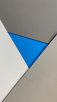 A modern geometric abstract design featuring a striking blue triangle amid neutral tones, ideal for creative projects.