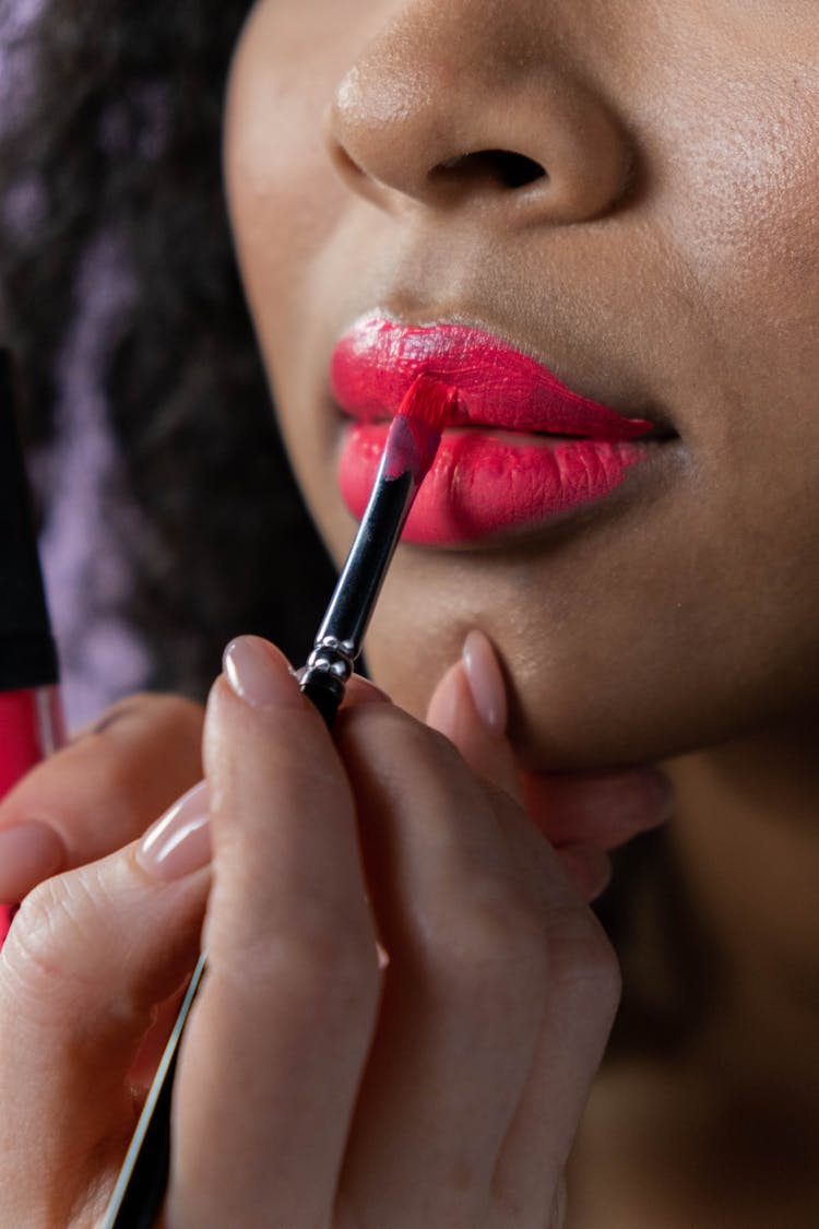 A Woman Lips Brushed With Lip Tint