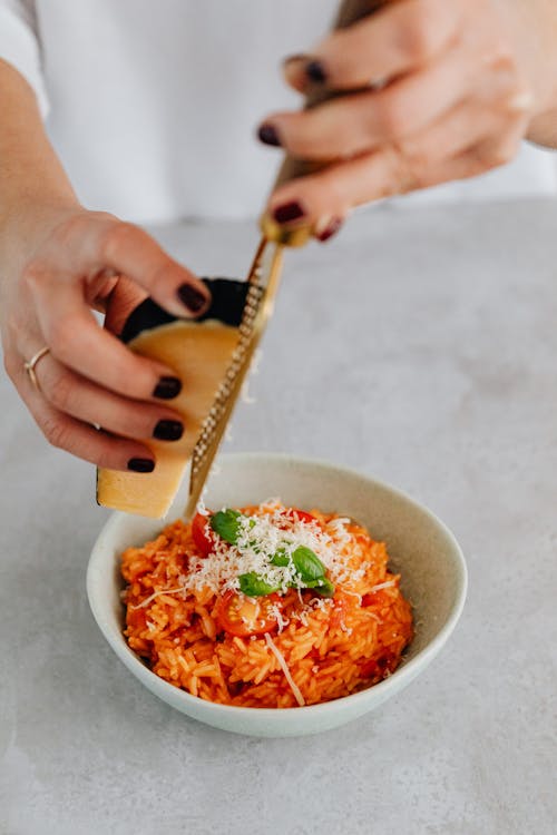Free Grated Cheese Toppings on Risotto Dish Stock Photo