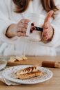 Person Garnishing Toast