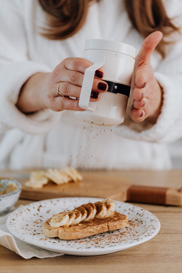 Person Garnishing Toast 