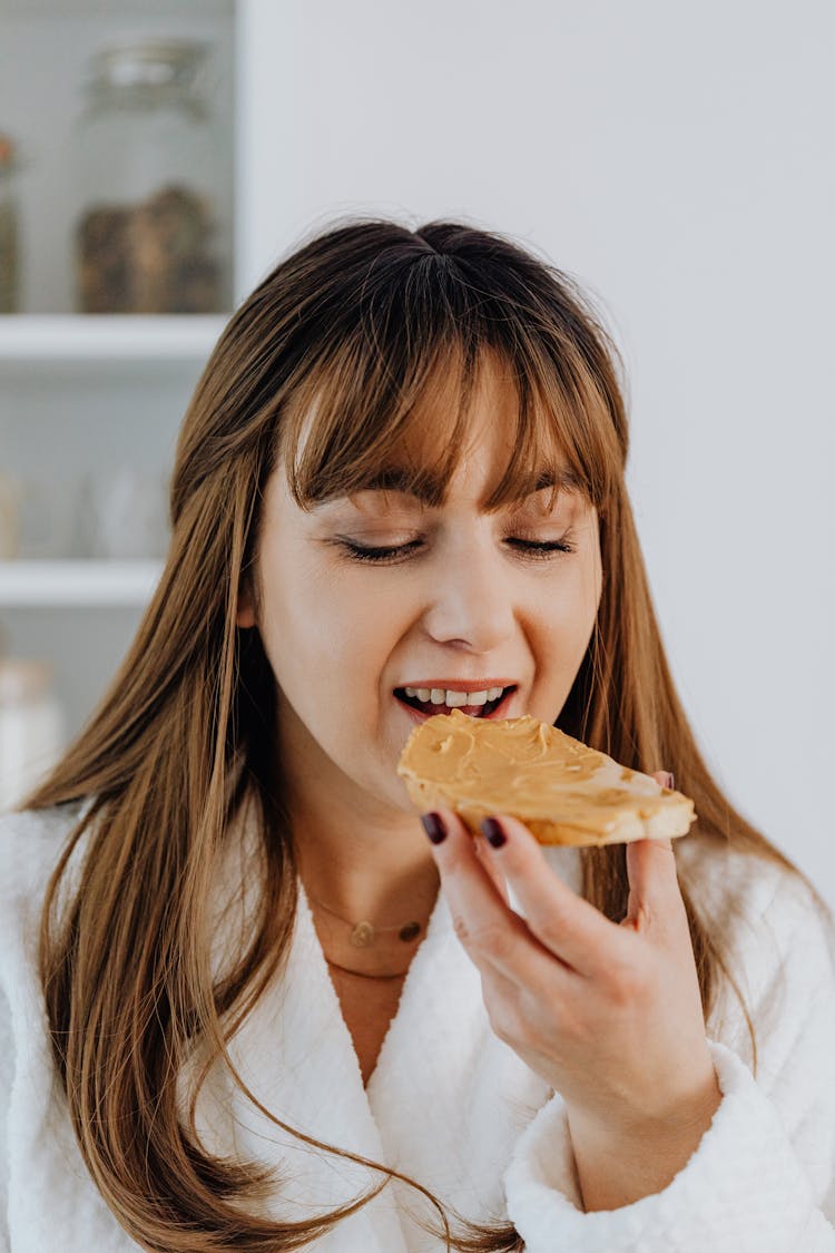 Woman Eating Peanut Butter Toast 