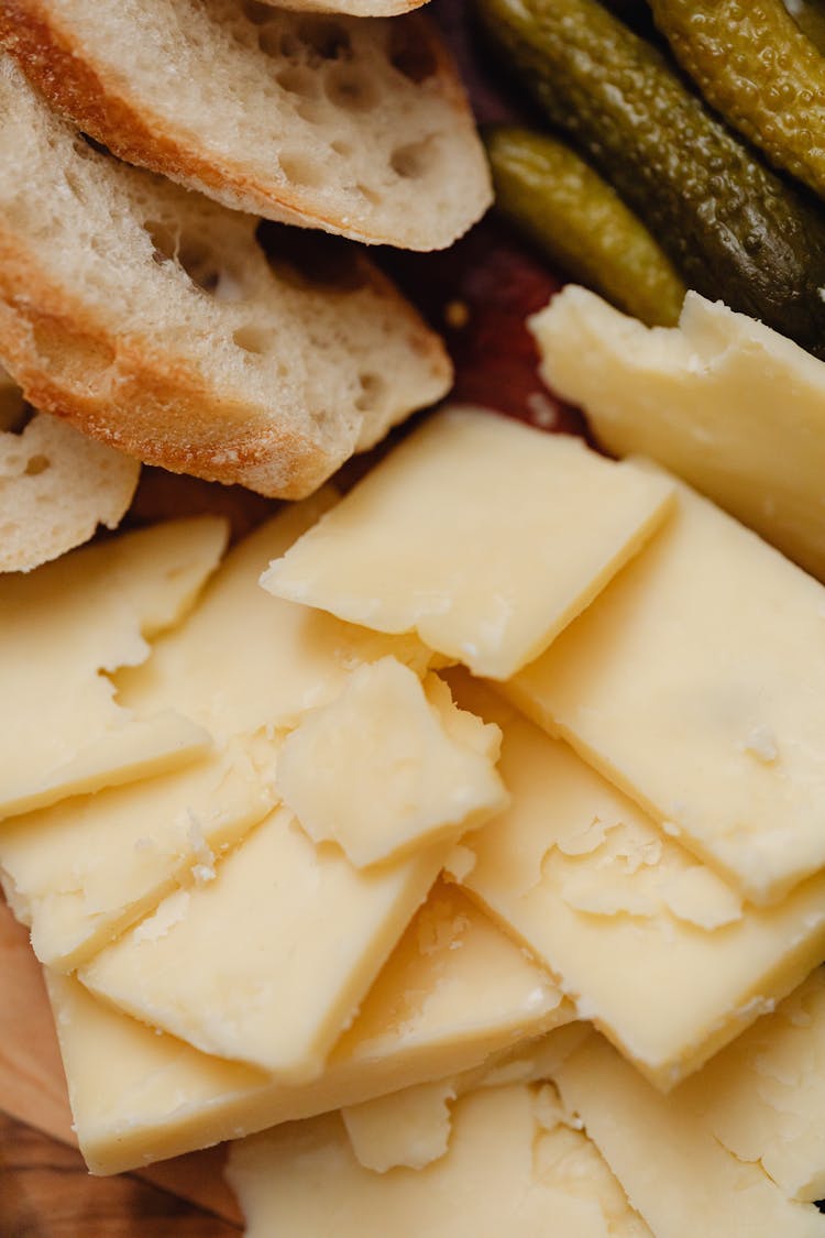 A Close-up Shot Of A Sliced Cheese And Bread