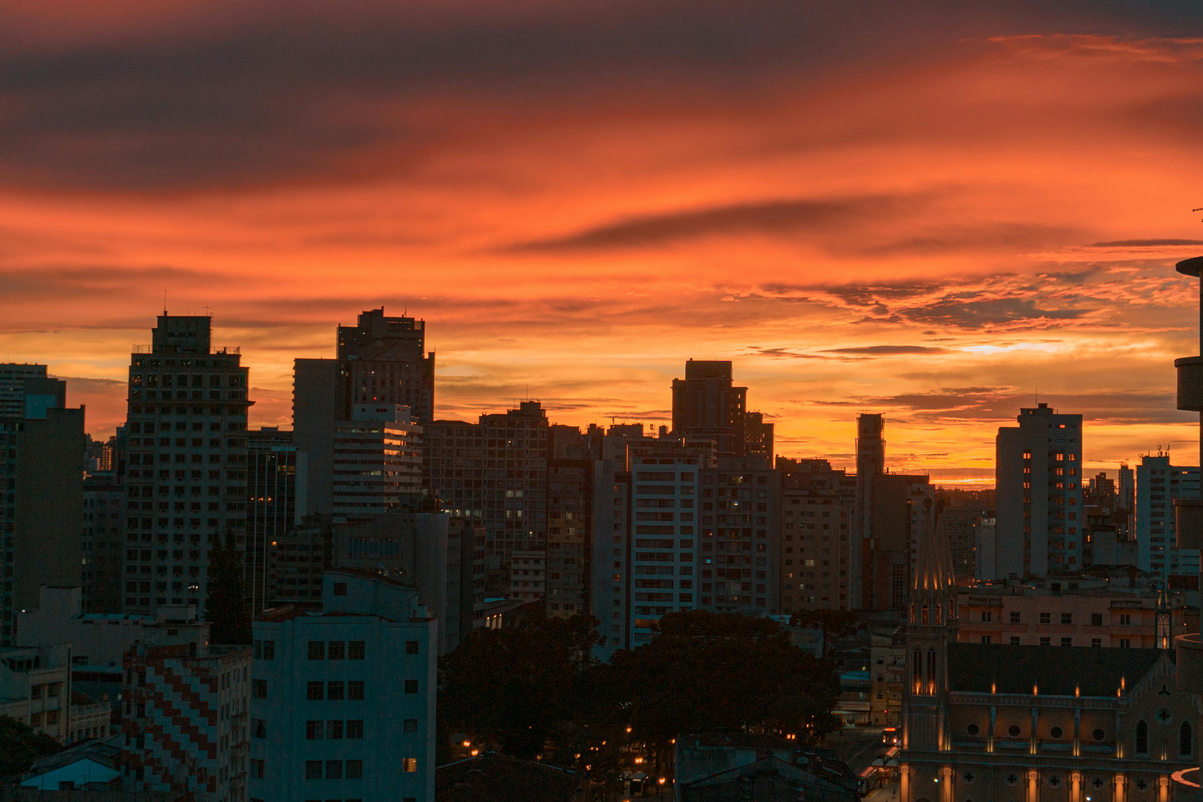 Neatly folded neutral-colored clothing and sweaters suggesting understated royal fashion choices