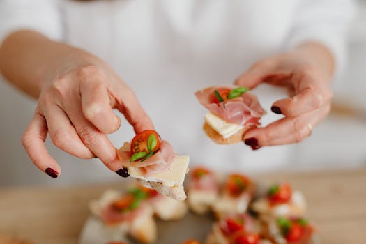 Delicious bruschetta topped with prosciutto, cheese, tomatoes, and herbs, perfect for appetizers.