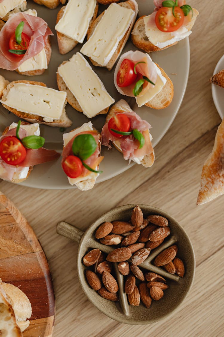 Bread With Cheese And Vegetables On The Wooden Surface