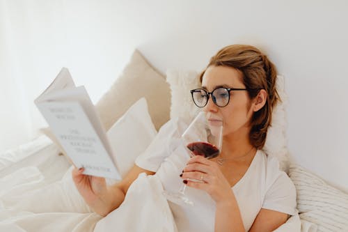 Free Woman in White Shirt Holding a Glass of Wine Stock Photo